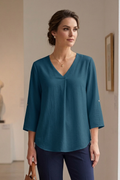 Blusa suelta manga 3/4 con charretera escote en V y pliegues