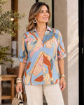 Blusa camisera escote en V manga 3/4 con charreteras